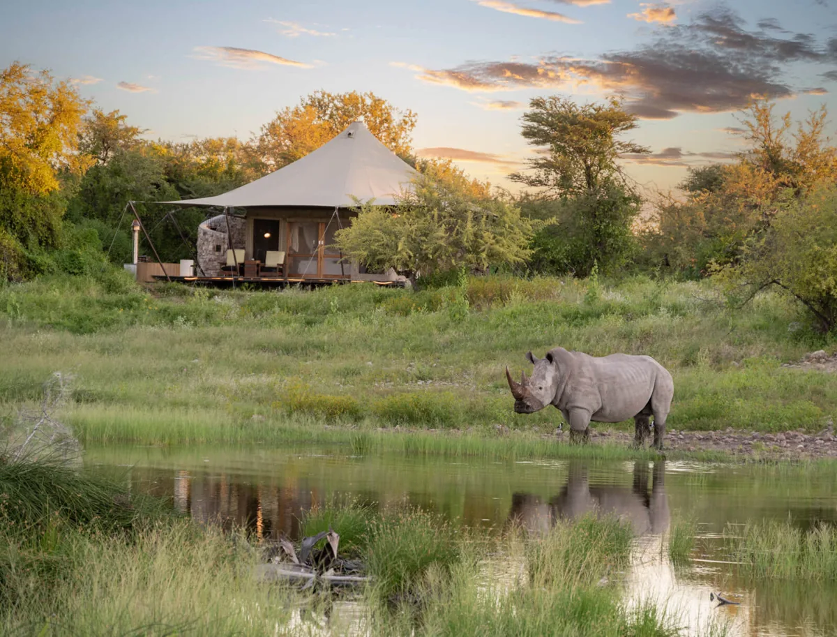 Onguma Tented Camp beside its waterhole in Namibia
