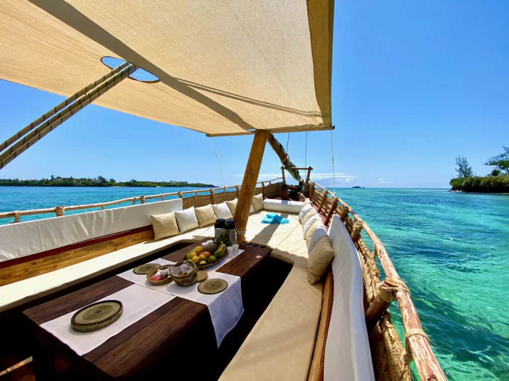The cushioned deck of The Rock & Sea’s traditional dhow on the water of Mida Creek